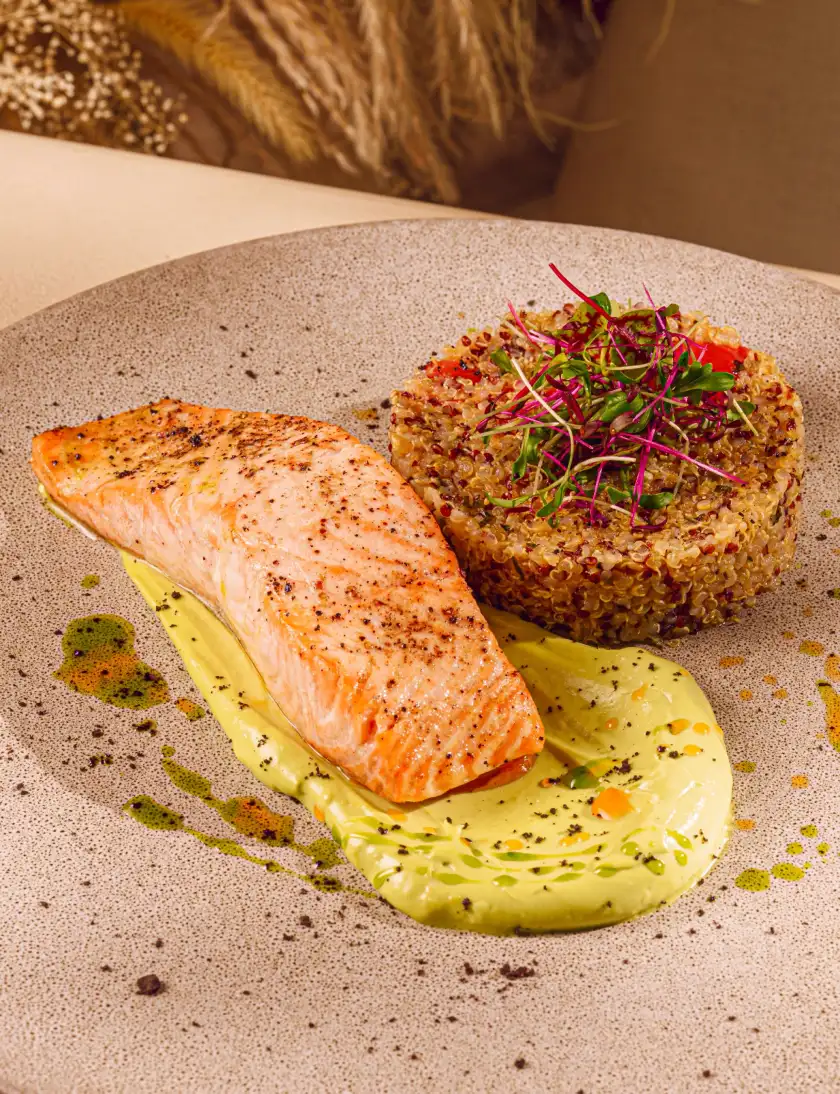 Grilled salmon with quinoa and herb sauce